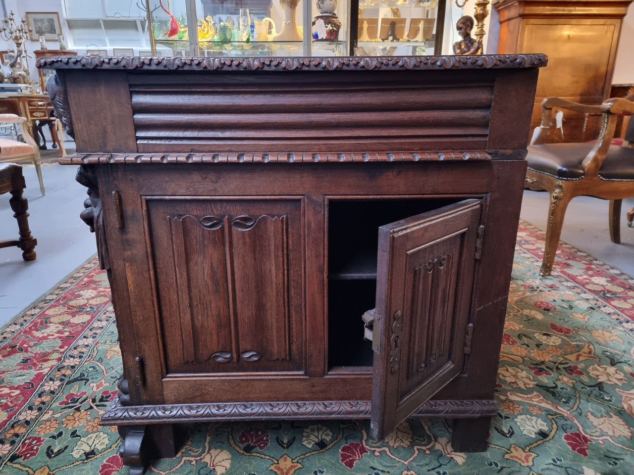 Beautifully carved French Oak early 19th century pedestal desk with 3 drawers, two cupboards and a secret cupboard on the side. There is also a lovely burgundy tooled leather top. In good original detailed condition.