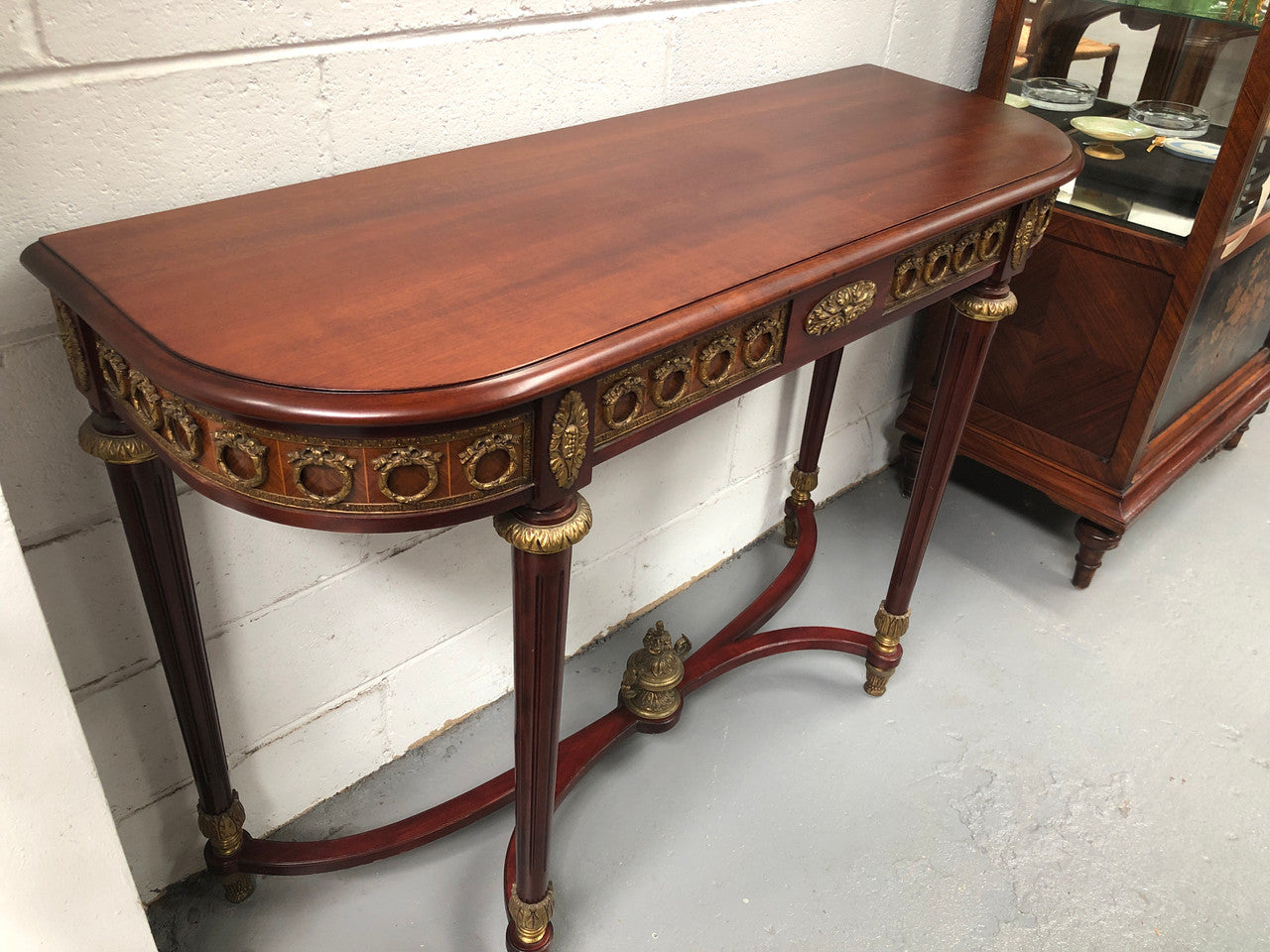 Fully restored decorative French style mahogany console table, with beautiful ormolu mounts and in very good condition.