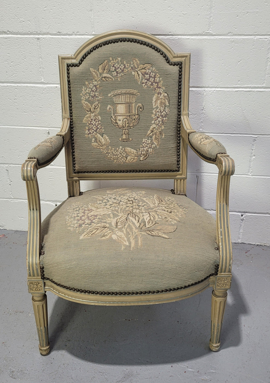 Lovely Louis XVI style painted fauteuil with lovely sage coloured tapestry upholstery. In good original condition and sourced directly from France.
