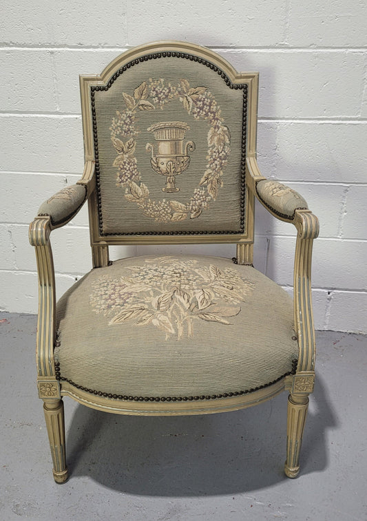 Lovely Louis XVI style painted fauteuil with lovely sage coloured tapestry upholstery. In good original condition and sourced directly from France.