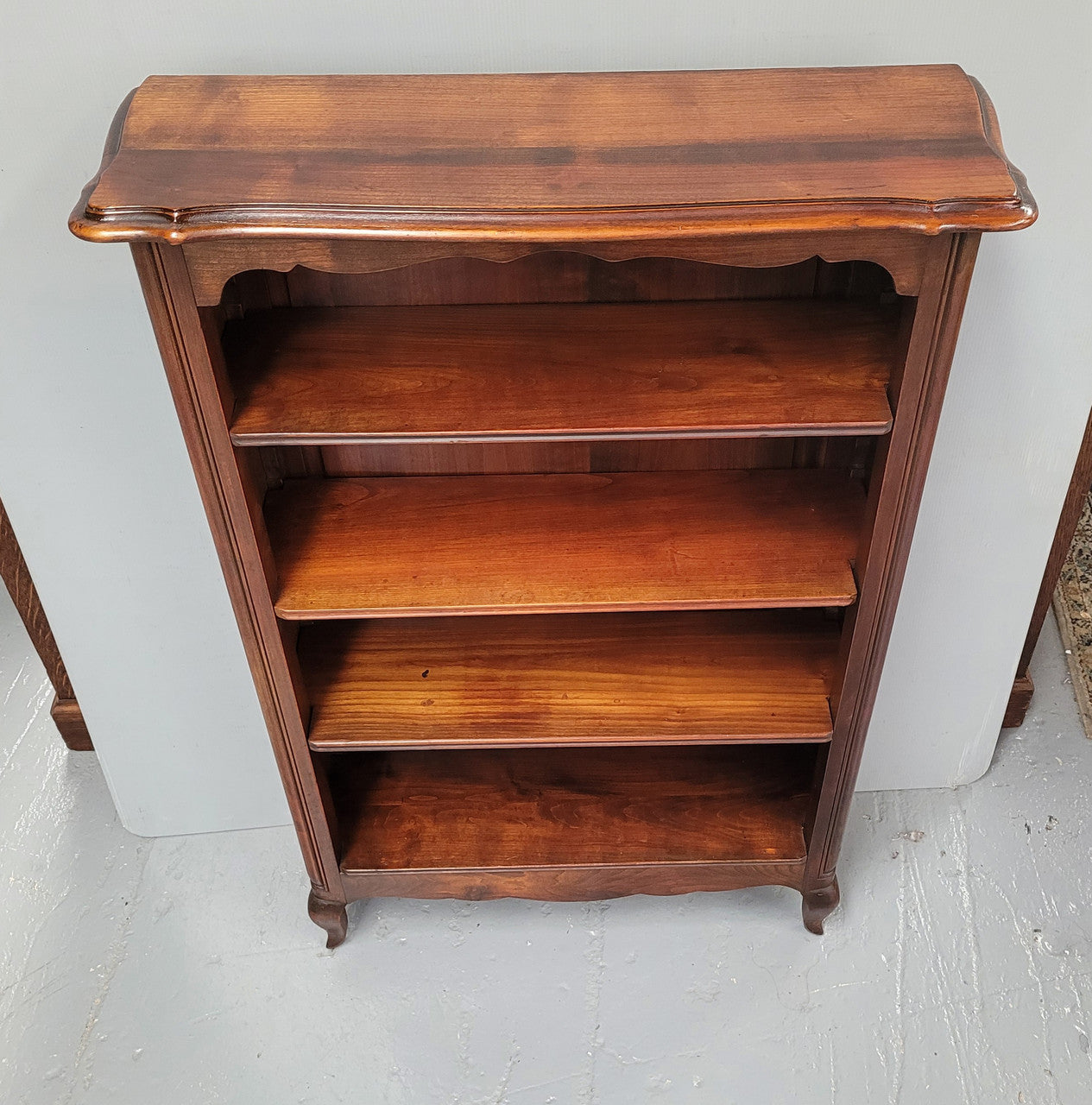 Compact French Louis XV Style Walnut four shelf open bookcase. In good original detailed condition.