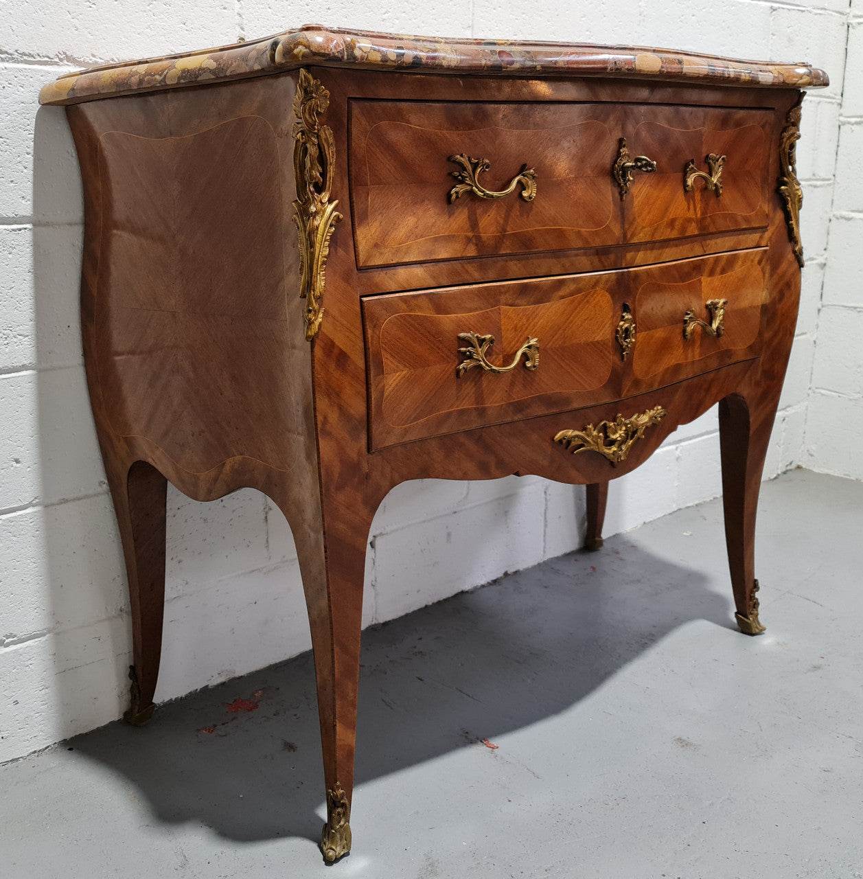 High quality French Mahogany Louis XVth style marble top commode. It has an eye catching marble top and is signed on body "J Bamelis". In very good original detailed condition.