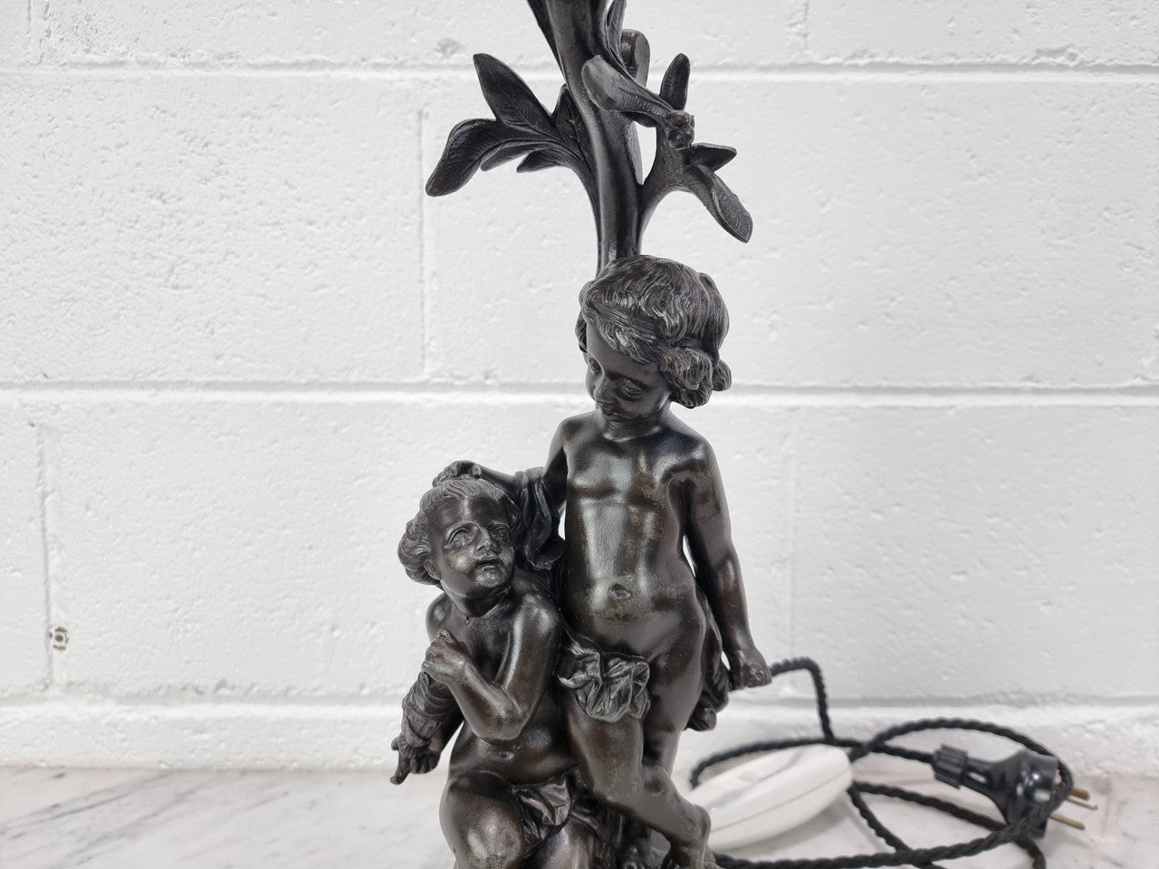 Antique French bronzed metal lamp with cherub's. in very good working original detailed condition.