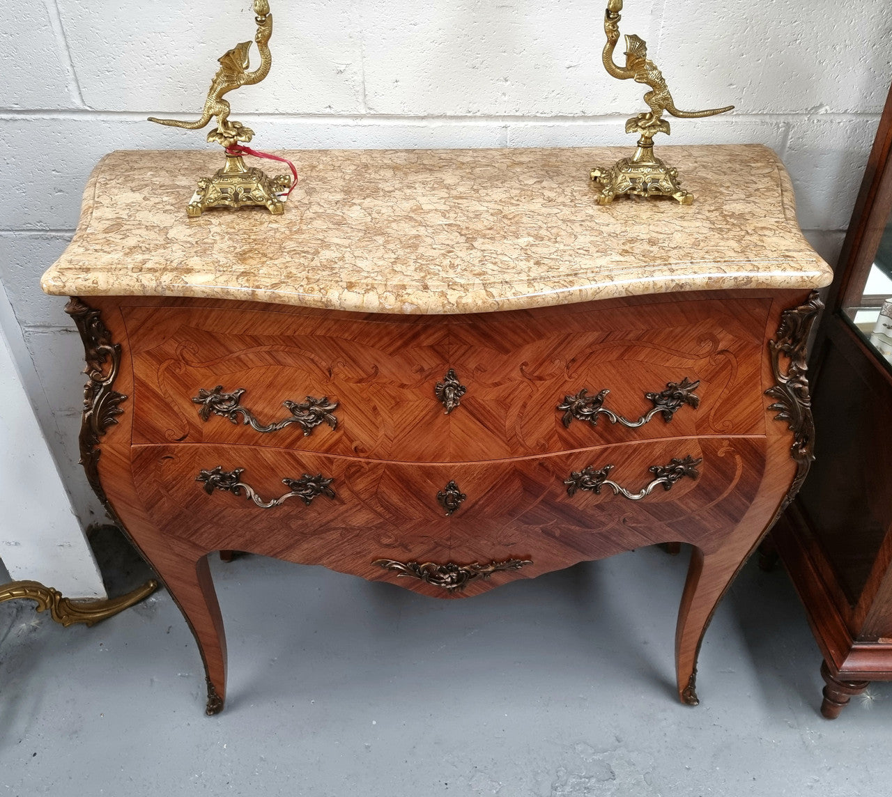French marquetry inlaid Kingwood marble top commode. It has two drawers and beautiful mounts. Is in good original detailed condition.