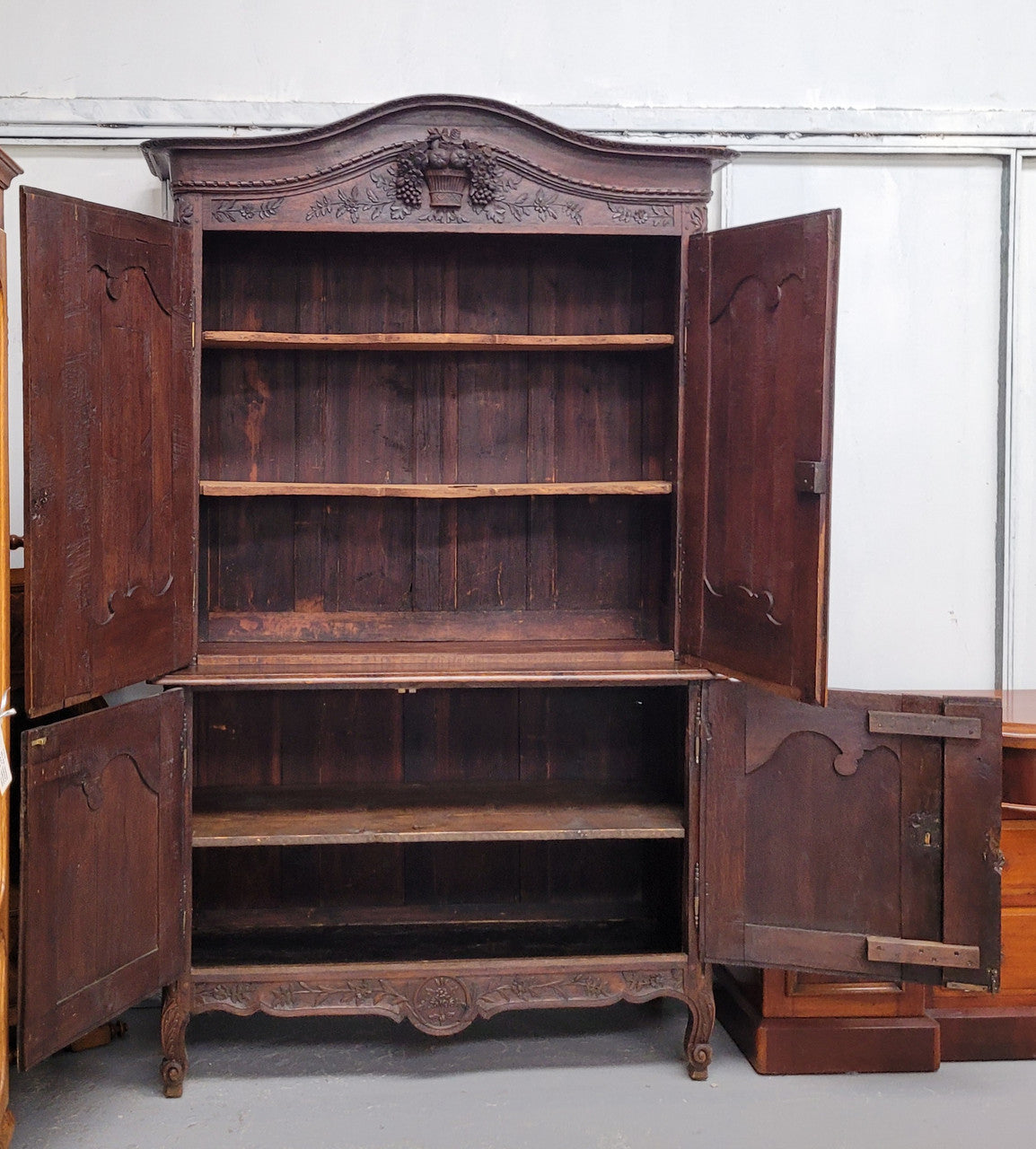 French Oak 18th Century superbly carved sideboard buffet. This amazing buffet has loads of character which is expected being circa 1790's. The top section has two fixed shelves and the bottom section has one fixed shelf. It has been sourced from France and is in good original detailed condition.