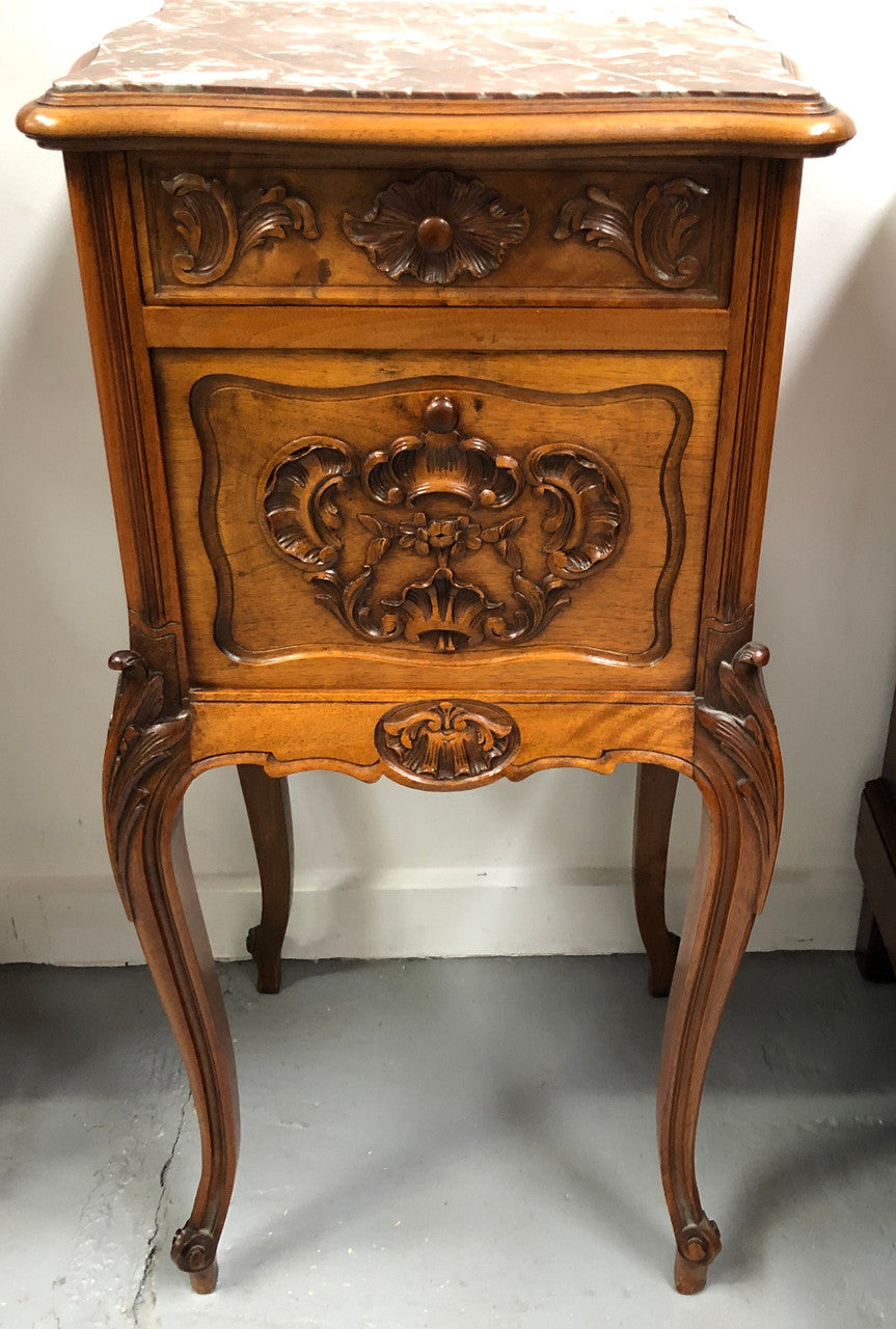 Single French carved bedside with inset marble top. It has beautiful carving and a drawer and cupboard for storage. In very good original detailed condition.
