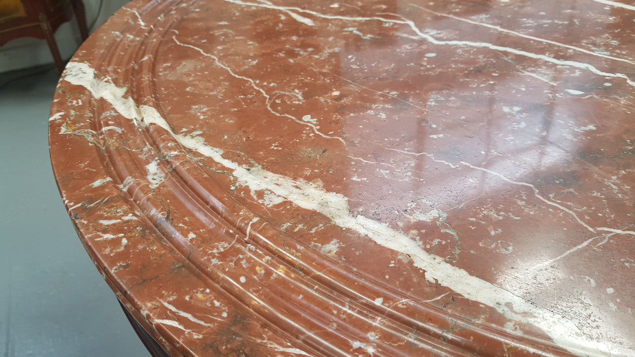 A superb early 19th century French Louis Philippe mahogany centre table, with original round carved rough marble with reeded-edge and is in good original condition.