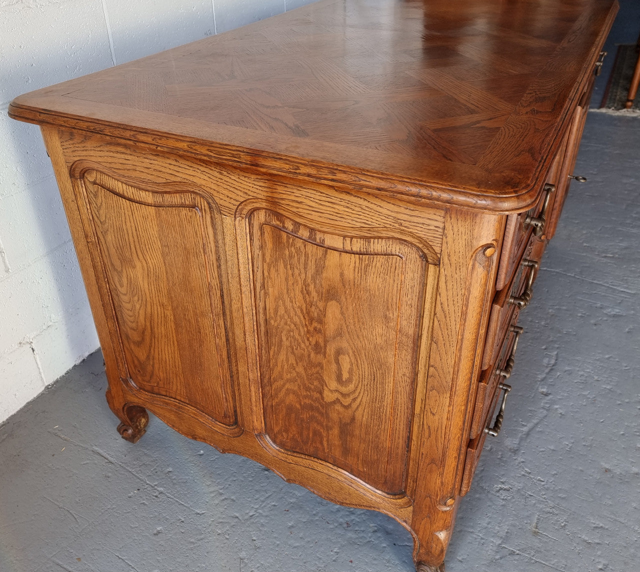 Beautifully carved french oak, faux partners desk with a lovely parquetry top and 6 drawers and 1 cupboard . In good original condition.
