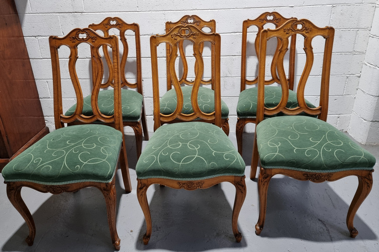 Set of six French style Oak decorative upholstered seat dining chairs. They are comfortable to sit in and are in good original condition, please view photos of fabric as the fabric is in good used condition.