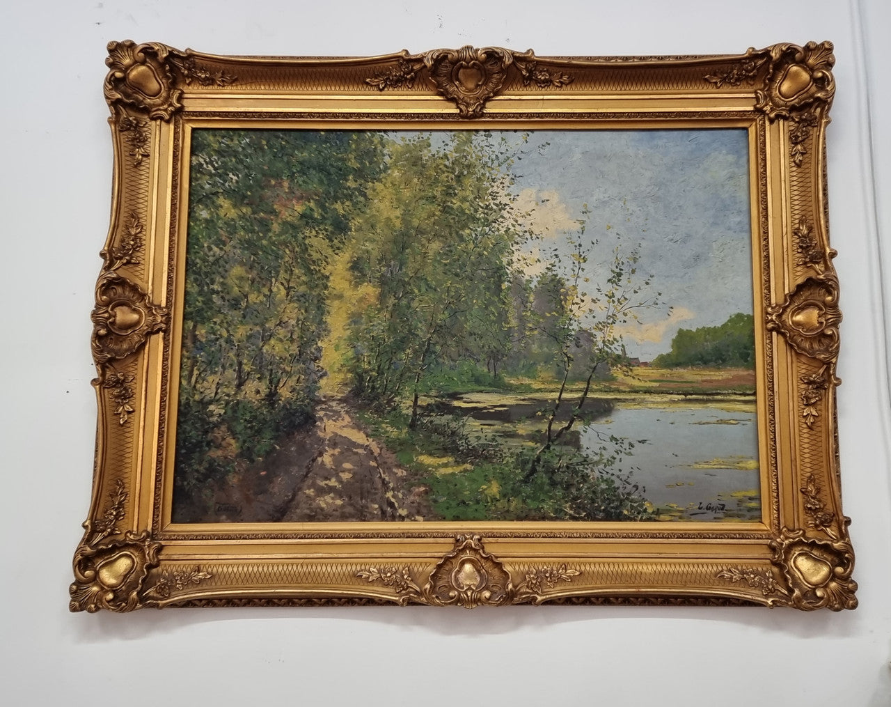 Sourced in France is this beautiful impressionist oil on canvas by "LOUIS GAROT". In a lovely ornate frame, signed and in good original condition.