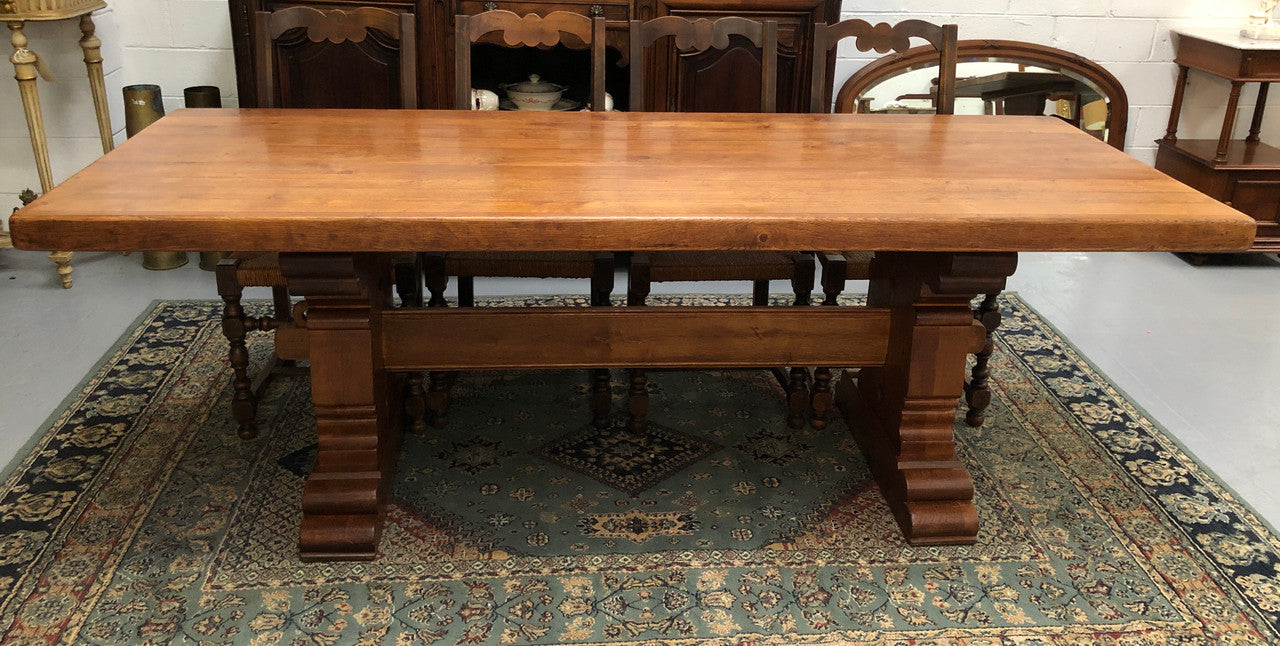 French Farmhouse table with a beautiful thick plank top and stretcher base. Can seat 8-10 people comfortably and is in good original detailed condition.