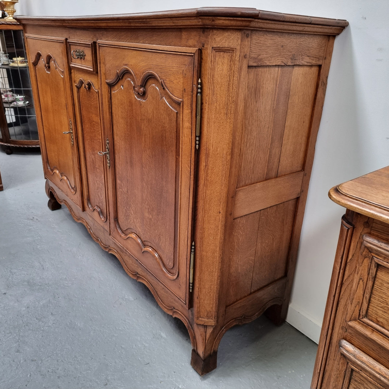 Amazing French Oak early 19th Century two door sideboard with one drawer and two fixed shelves. Sourced from France and in good original detailed condition.
