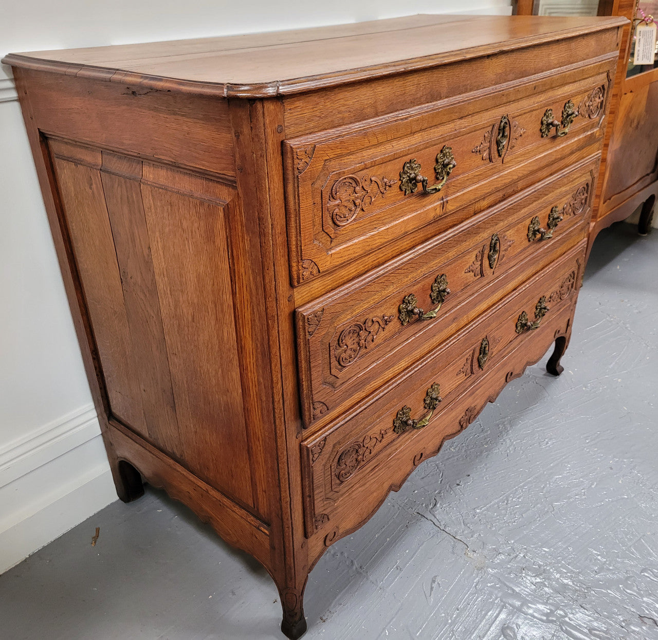 French Louis 15th style large three drawer chest featuring carved drawers. It has been sourced from France and is in good original detailed condition.