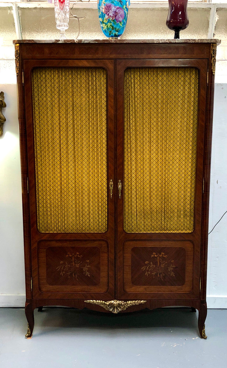 Beautiful 19th Century French Louis XV style Mahogany Blind Bookcase. This piece has lovely inlaid doors and ormolu mounts, marble top and four adjustable shelves. In good original detailed condition.