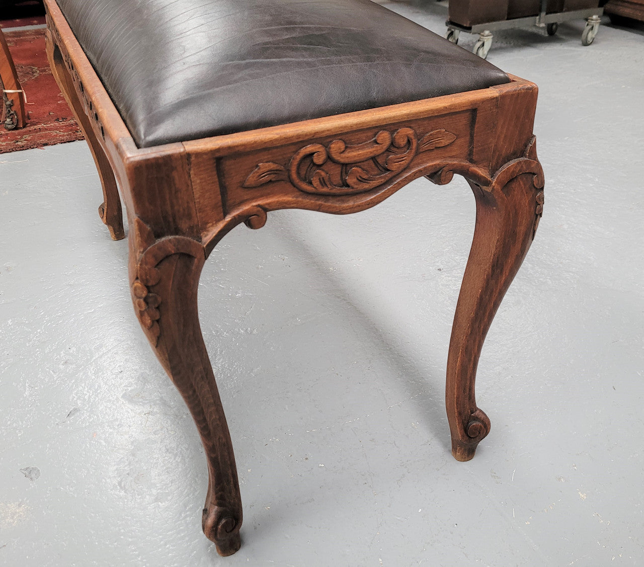 French Oak newly upholstered leather look duet stool. In good original detailed condition and new upholstery.