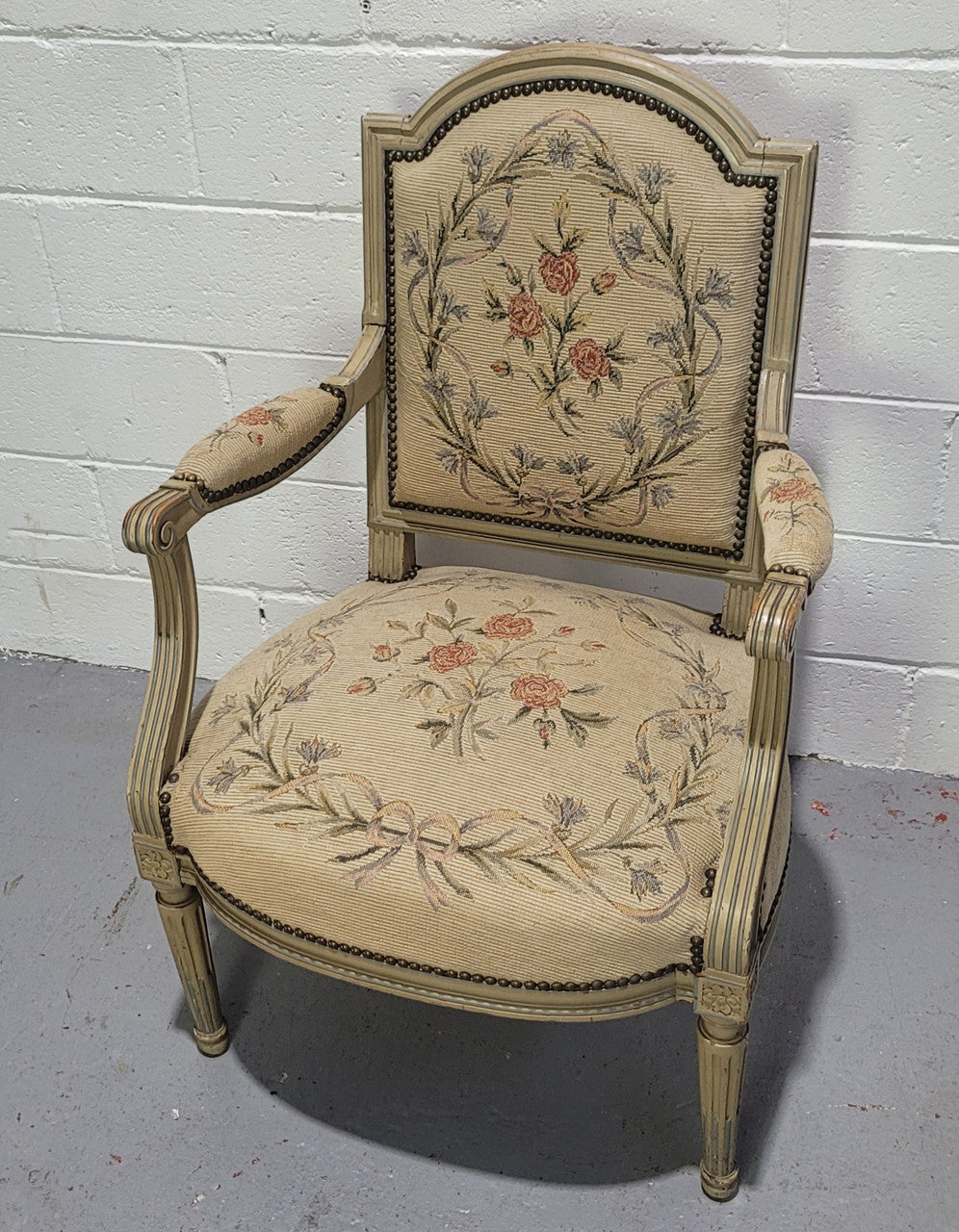 Lovely French Louis XVI style painted and Tapestry upholstered fauteuil. In good original condition, and very comfortable.