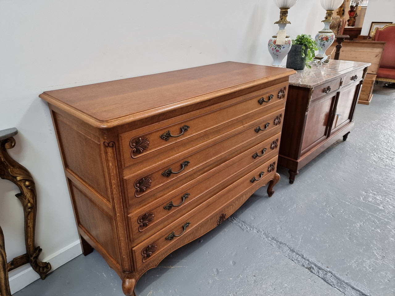 Fabulous French light Oak of chest of four drawers with lovely decorative carving. In good original detailed condition.