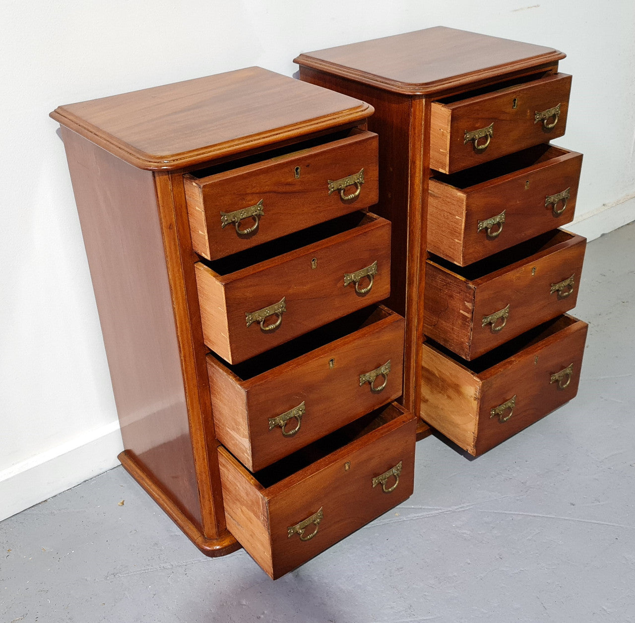 Pair of English Victorian Mahogany bedside drawers. In good original detailed condition.
