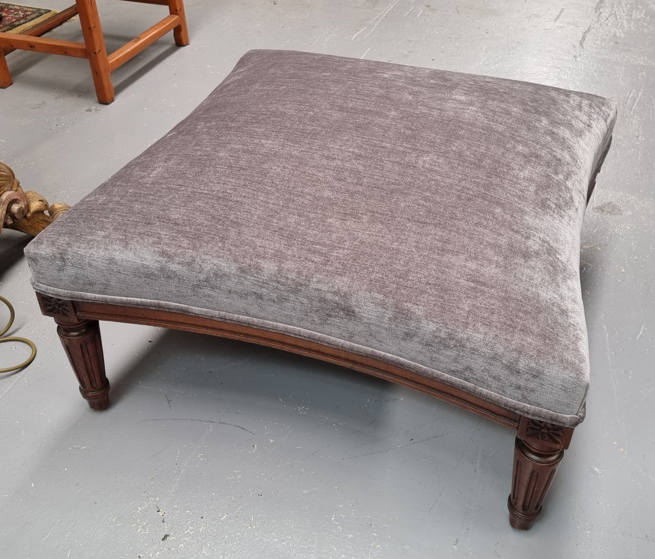 Amazing French Louis 16th Style large walnut footstool with new grey upholstery. Circa: 1900. In good detailed condition.