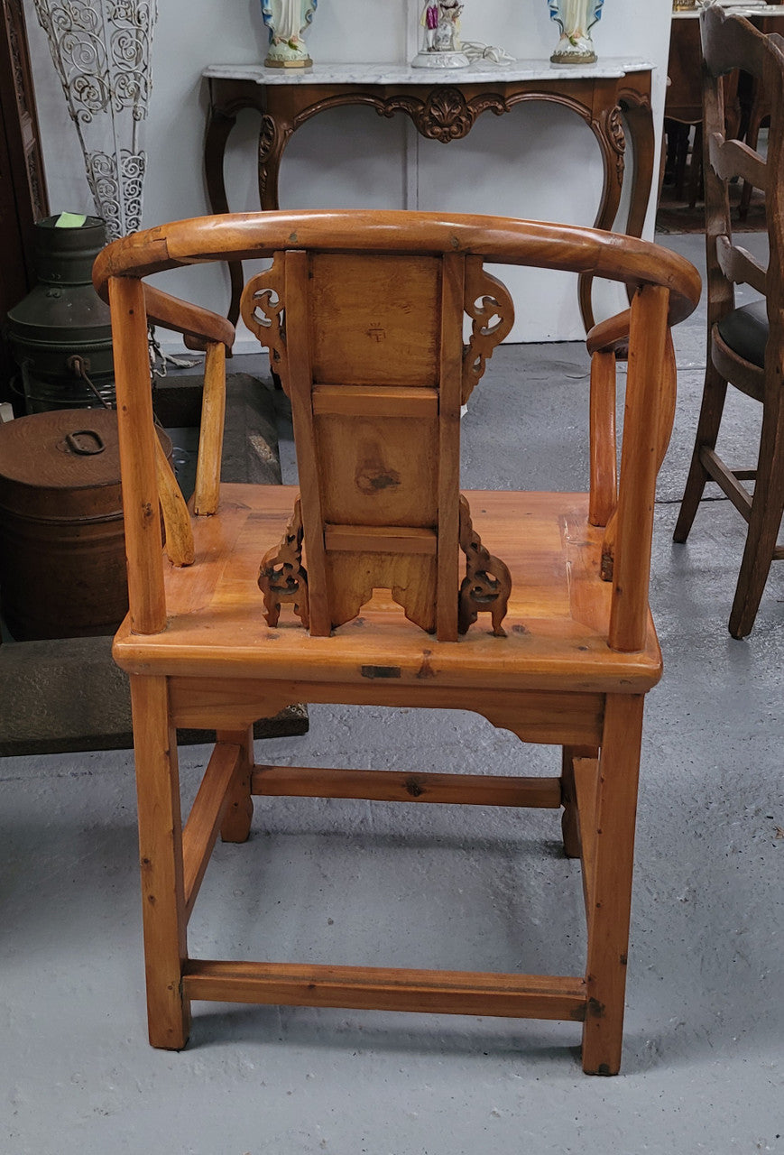 Lovely Chinese Elm horseshoe chair, featuring stunning carving and it is in good original detailed condition.