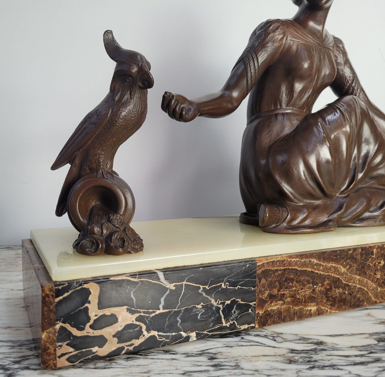 Art Deco bronze statue with brown patina of a lady and parrot on marble base. Signed by Italian Sculptor A Trefolini, an highly regarded sculptor, in very good condition.