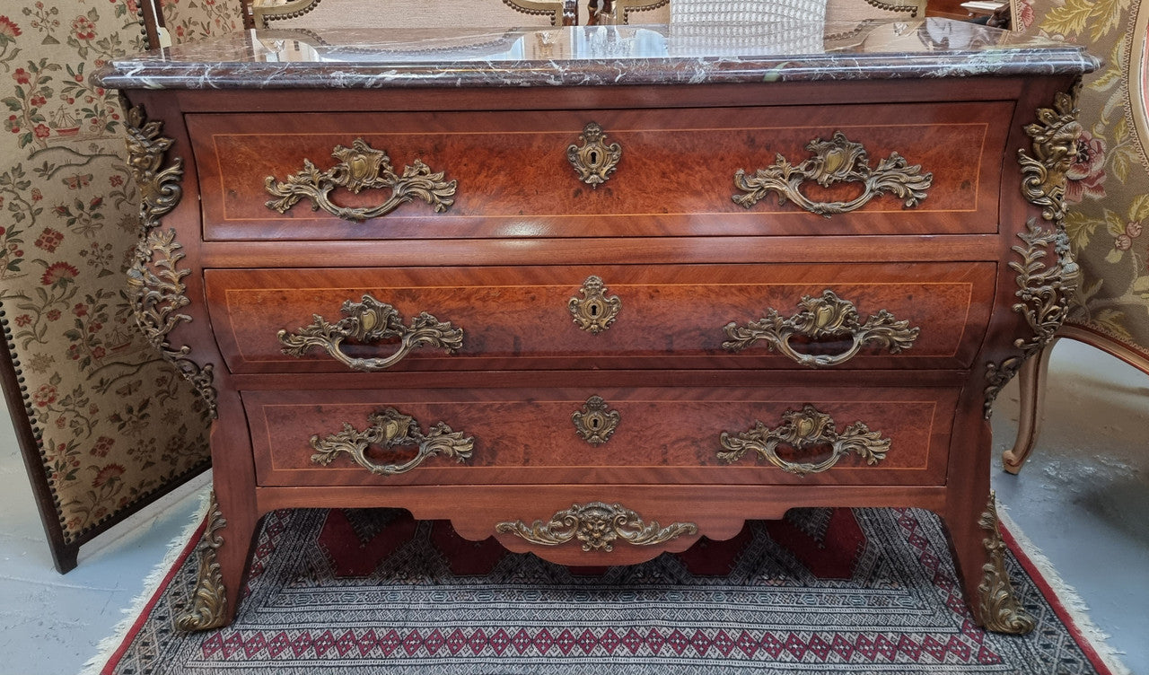 French Louis XVI style three drawer commode with amazing coloured marble. It has decorative brass mounts and is in very good original detailed condition.
