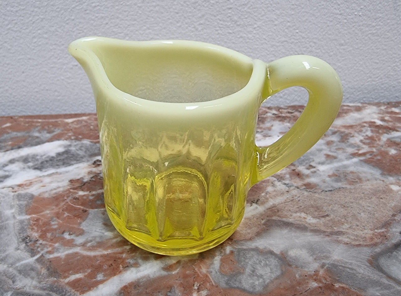 A fabulous rare Vaseline glass small jug and sugar bowl in good original condition.