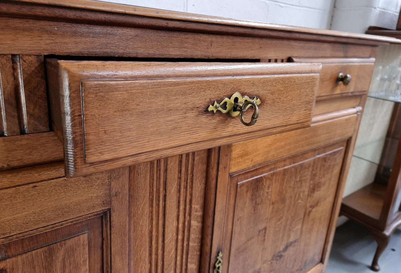 French Oak Early 19th Century sideboard with two doors and three drawers. In good original condition.