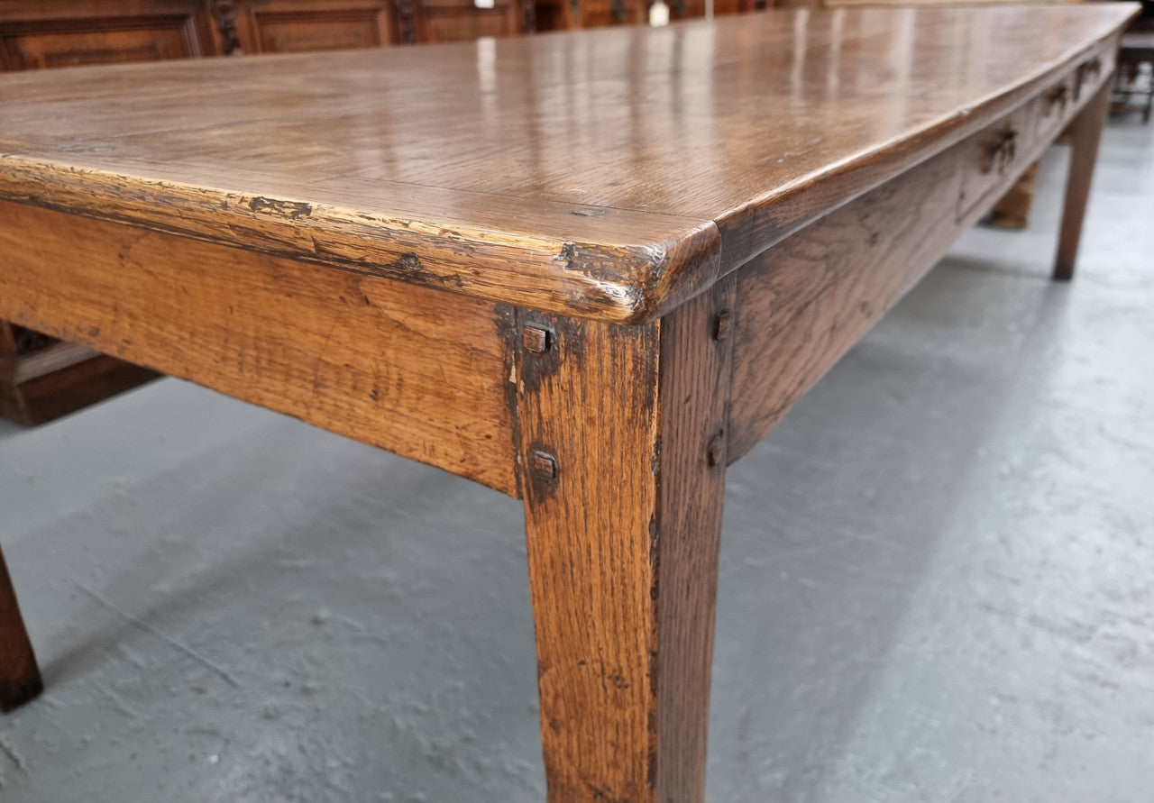 Amazing 19th Century French Oak Farmhouse Style Dining Table with three drawers. It is made from 3 large planks of wood which is very hard to find. 105.5 cm wide.