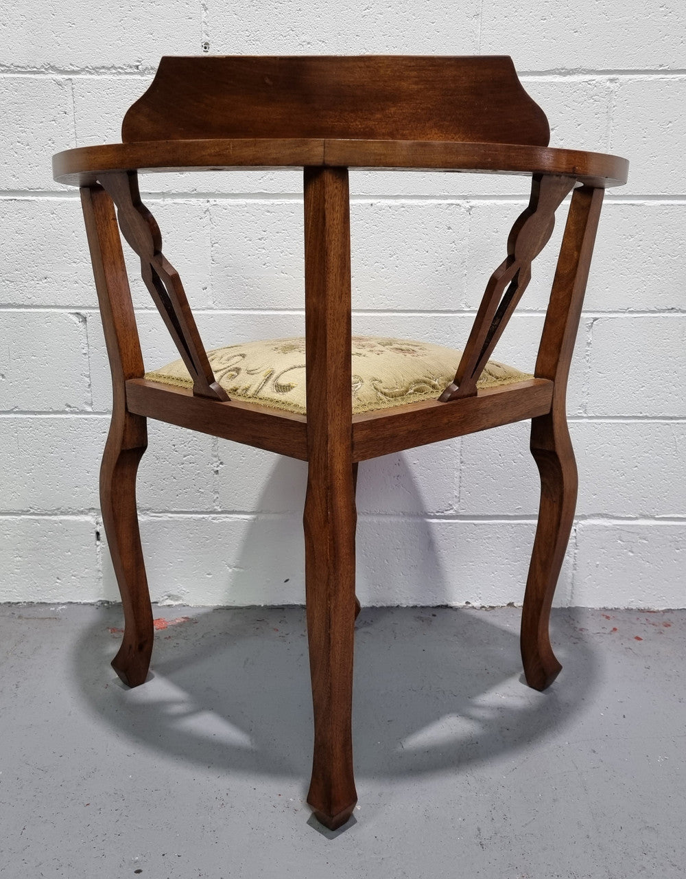 Mahogany upsholstered corner chair. It is in good original condition with clean upholstery.