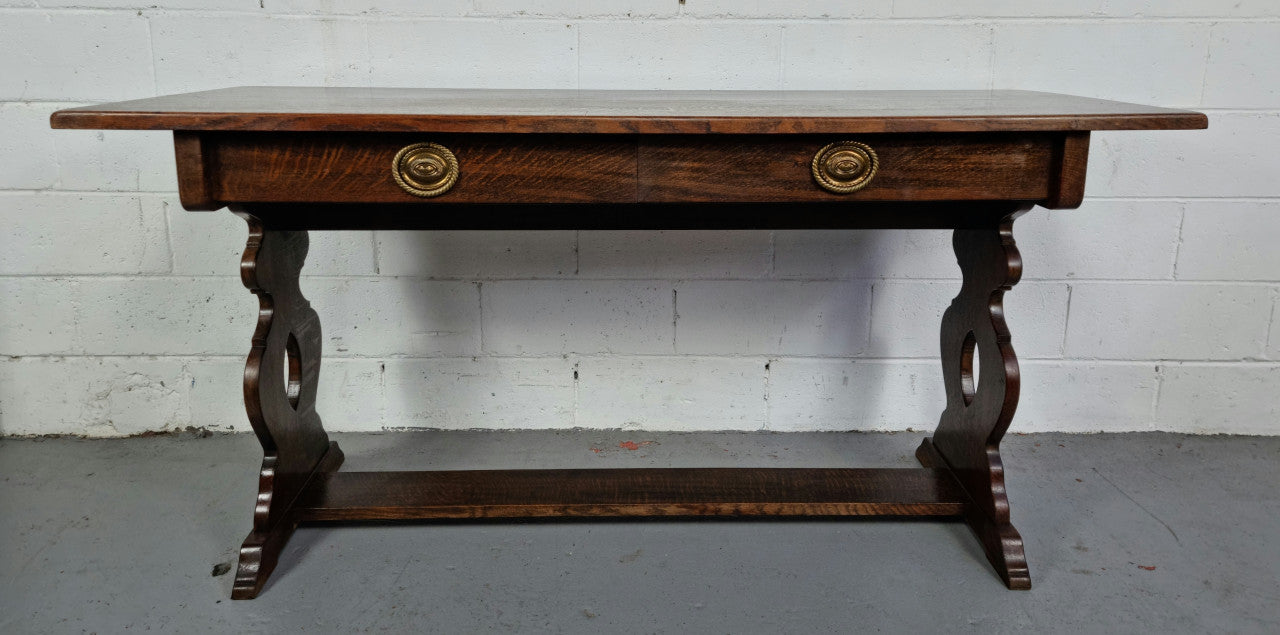 French dark Oak two drawer console table. It has loads of character and is in good original detailed condition.