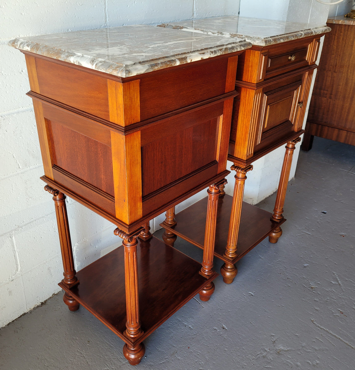 Pair of Henry II style Walnut bedside cabinets with a marble top. Circa 1920s and in good original condition.