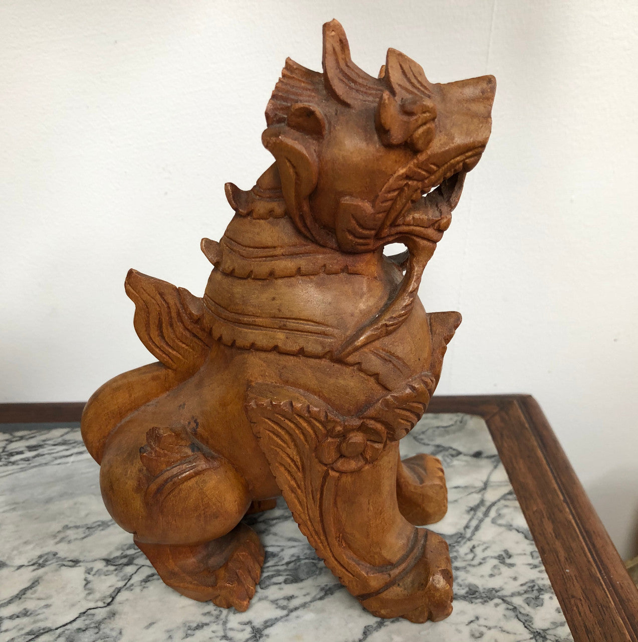 Chinese carved Teak Foo dog with very good detail. In good original condition.
