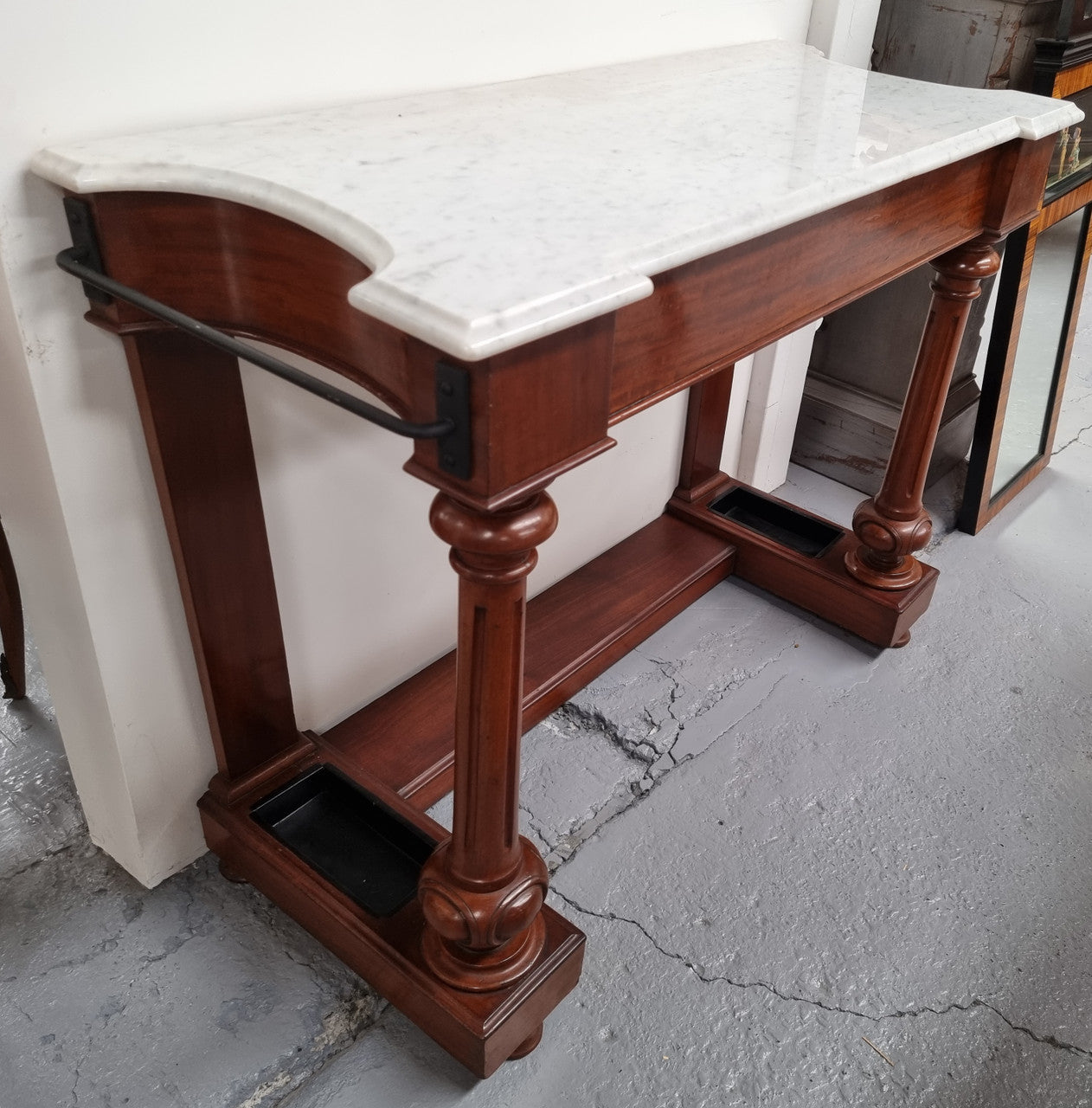 Classic Victorian mahogany console table with white marble top, one drawer and accommodation for sticks/umbrellas. In good original detailed condition.