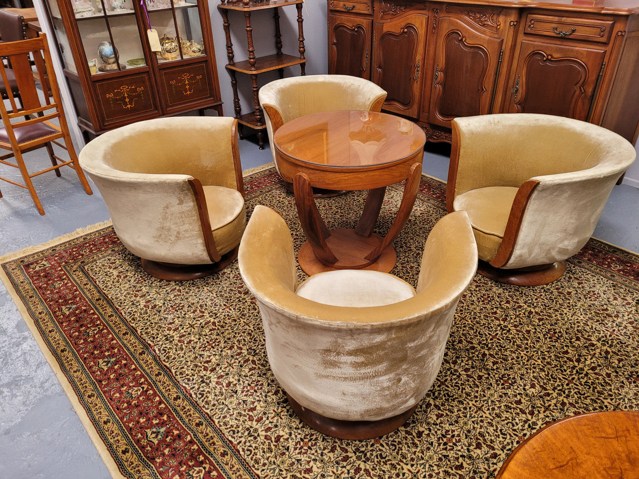 Four stunning original Art Deco Tulip shaped salon lounge chairs made specifically for the Hotel Le Malandre, Belgium in the 1930’s. They are marked with a metal tag “Hotel Le Malandre Modele Depose” Burl Walnut, Walnut and gold coloured velvet upholstery and rest on a thick wooden circular base it has been sourced in France and in good original condition. Included in the set is the accompanying Art Deco Walnut with glass top side table also made for Hotel Le Malandre and marked with the metal tag. Absol
