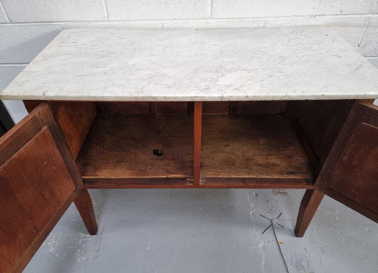 Blackwood two door white marble top cabinet. This would be ideal to be used as an entertainment unit, a TV stand or TV cabinet. In good original condition.
