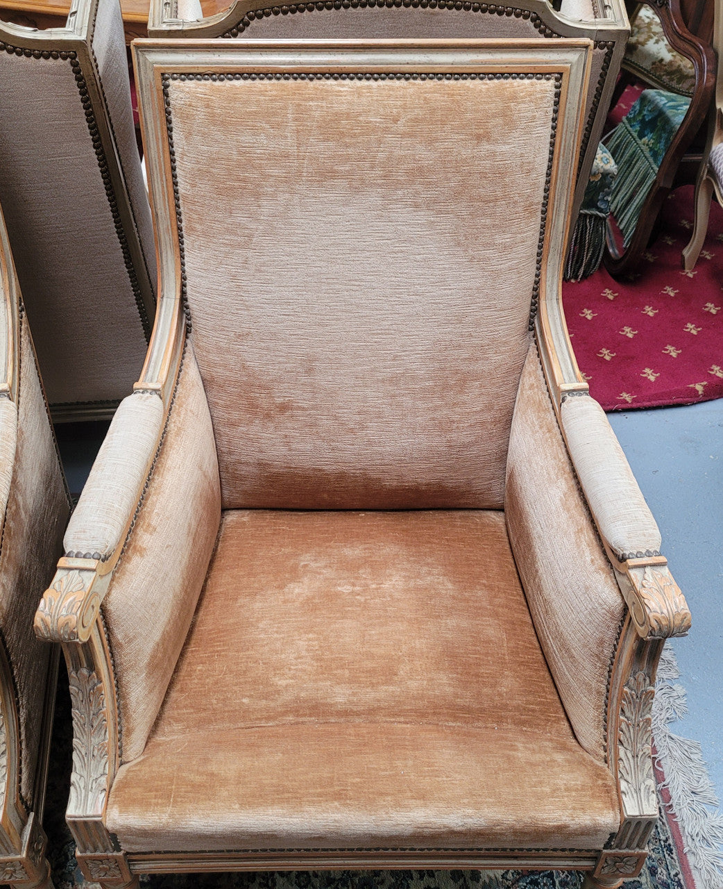 Pair of Louis XVI style painted arm chairs with carving & fluted legs. They have been sourced from France and the fabric is in good used original condition. Please view photos as they help form part of the description.