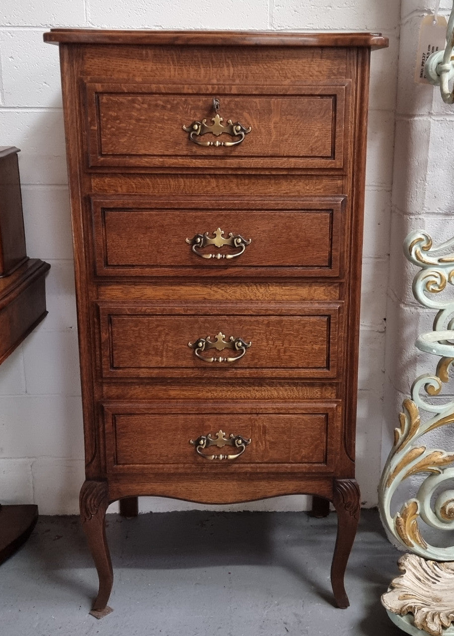 Elegant French Oak Louis XV style four drawer chest of drawers. It has lovely carvings and it is in good original detailed condition. It has been sourced from France.