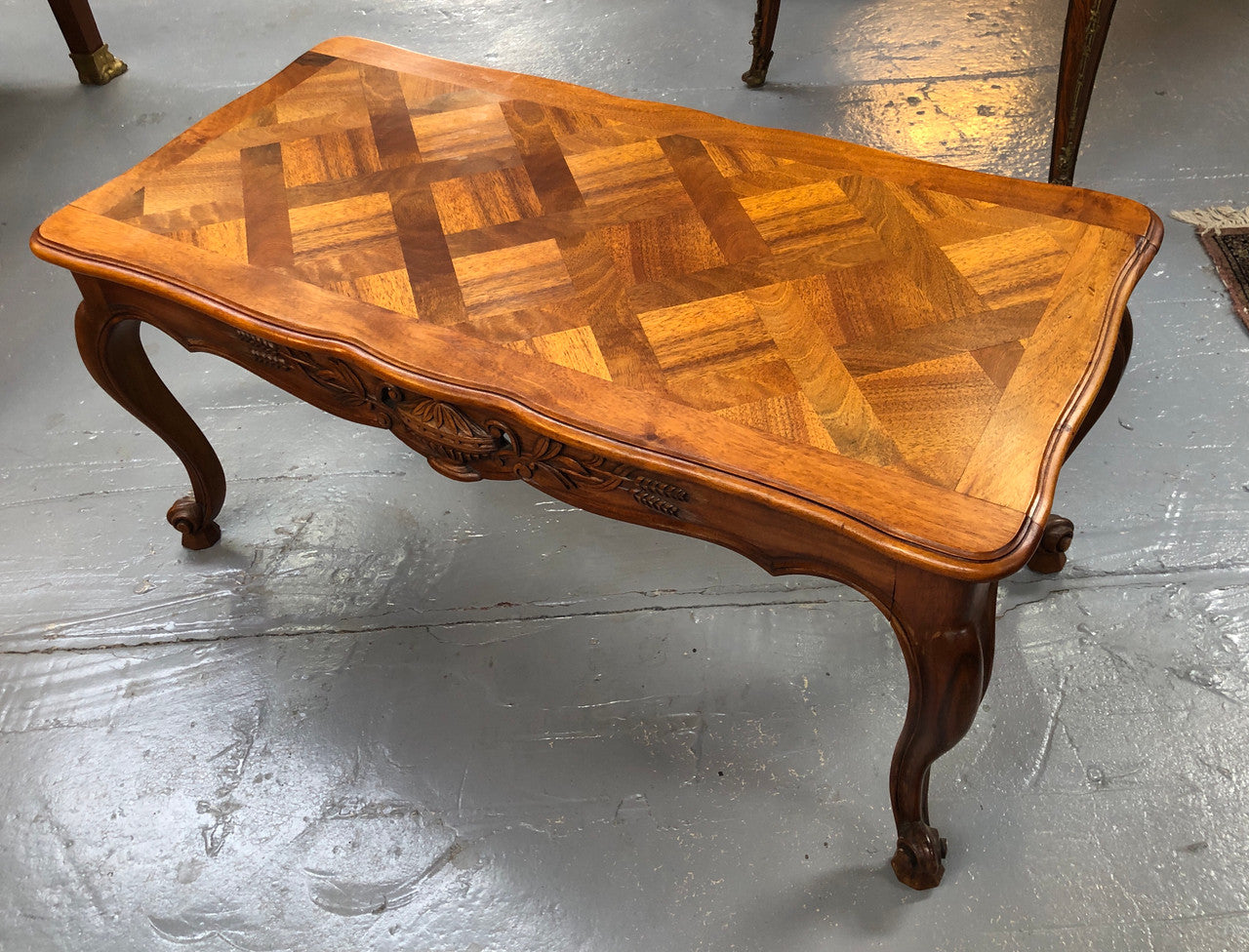 French Walnut parquetry top coffee table. In good original detailed condition. Circa: 1950's
