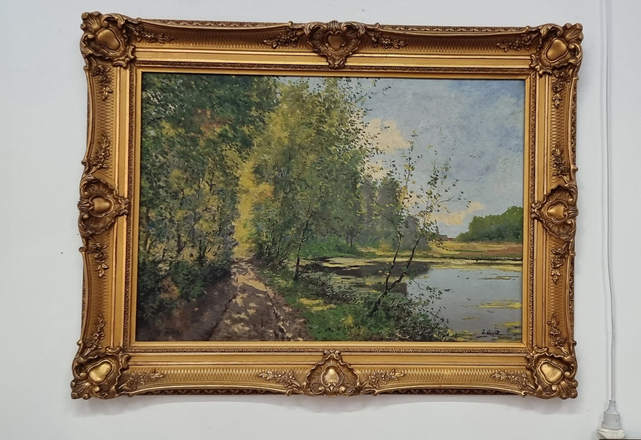 Sourced in France is this beautiful impressionist oil on canvas by "LOUIS GAROT". In a lovely ornate frame, signed and in good original condition.