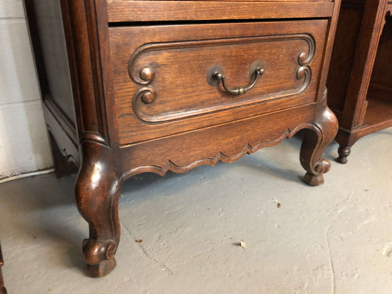 Antique French Oak Louis XV style four drawer bedside cupboard/side cupboard. In good original detailed condition. Circa 1910.