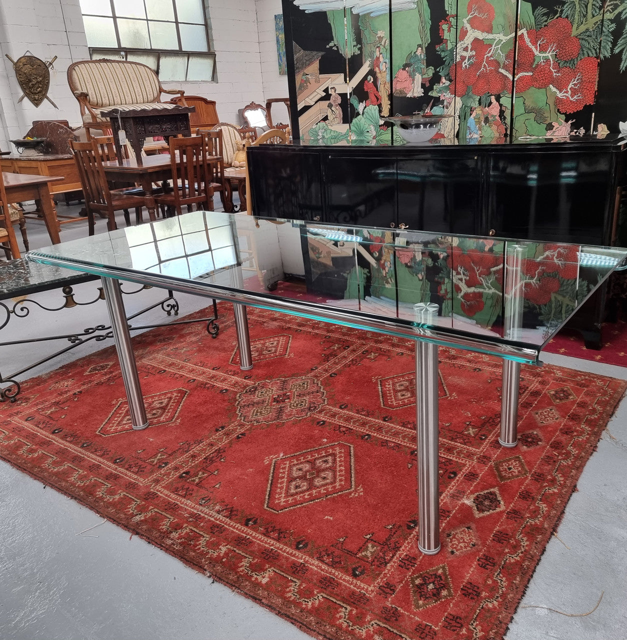 Striking and distinctive Vintage FIAM Italia Designer curved edge glass desk. FIAM was founded in 1973 by Vittorio Livio and has become synonymous with glass culture in Italy and the World. FIAM is still manufacturing today, in collaboration with various Designers, and has won numerous awards and is represented in various international museums. 
Condition: Evidence of use with minor scratches to the surface and a small chip that has been repaired. Overall, in very good condition with one repaired chip to t