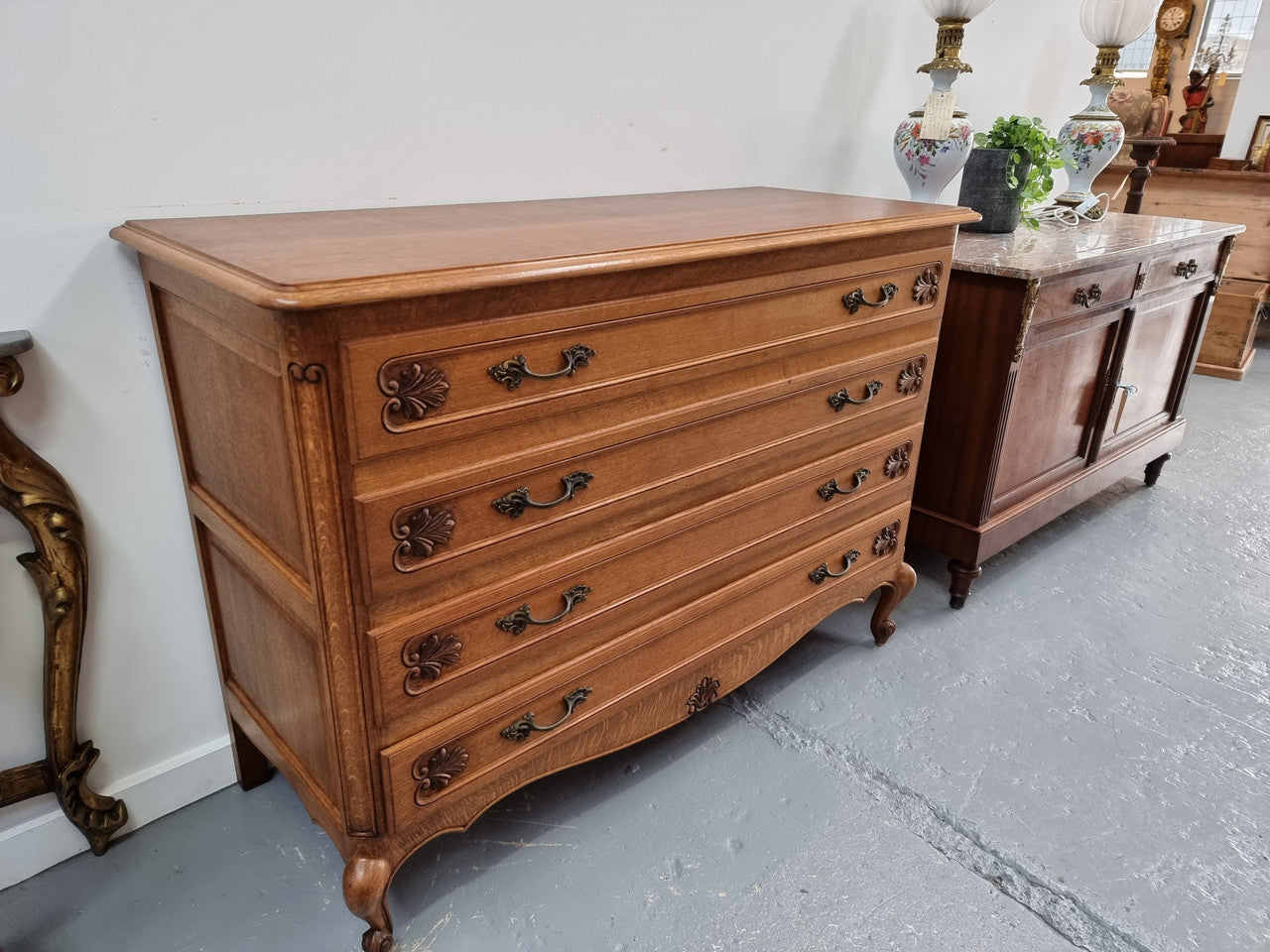 Fabulous French light Oak of chest of four drawers with lovely decorative carving. In good original detailed condition.