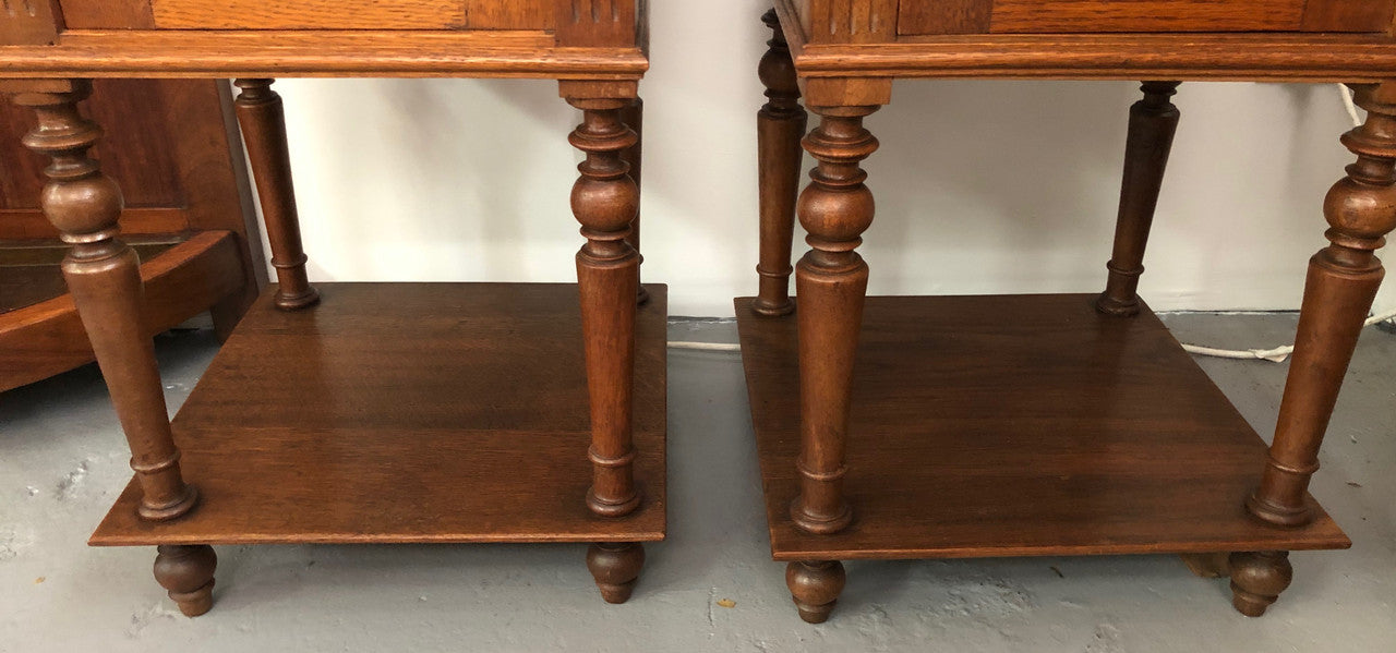 A lovely pair of French Oak, marble top bedside cabinets with a cupboard and drawer in good original condition.