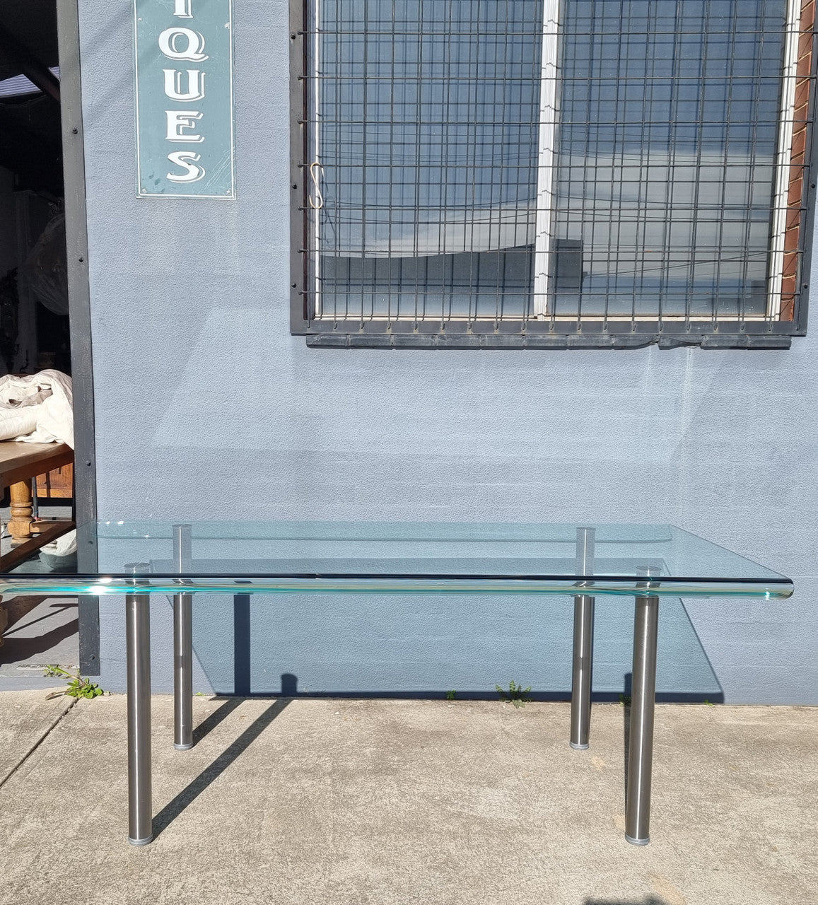 Striking and distinctive Vintage FIAM Italia Designer curved edge glass desk. FIAM was founded in 1973 by Vittorio Livio and has become synonymous with glass culture in Italy and the World. FIAM is still manufacturing today, in collaboration with various Designers, and has won numerous awards and is represented in various international museums. 
Condition: Evidence of use with minor scratches to the surface and a small chip that has been repaired. Overall, in very good condition with one repaired chip to t