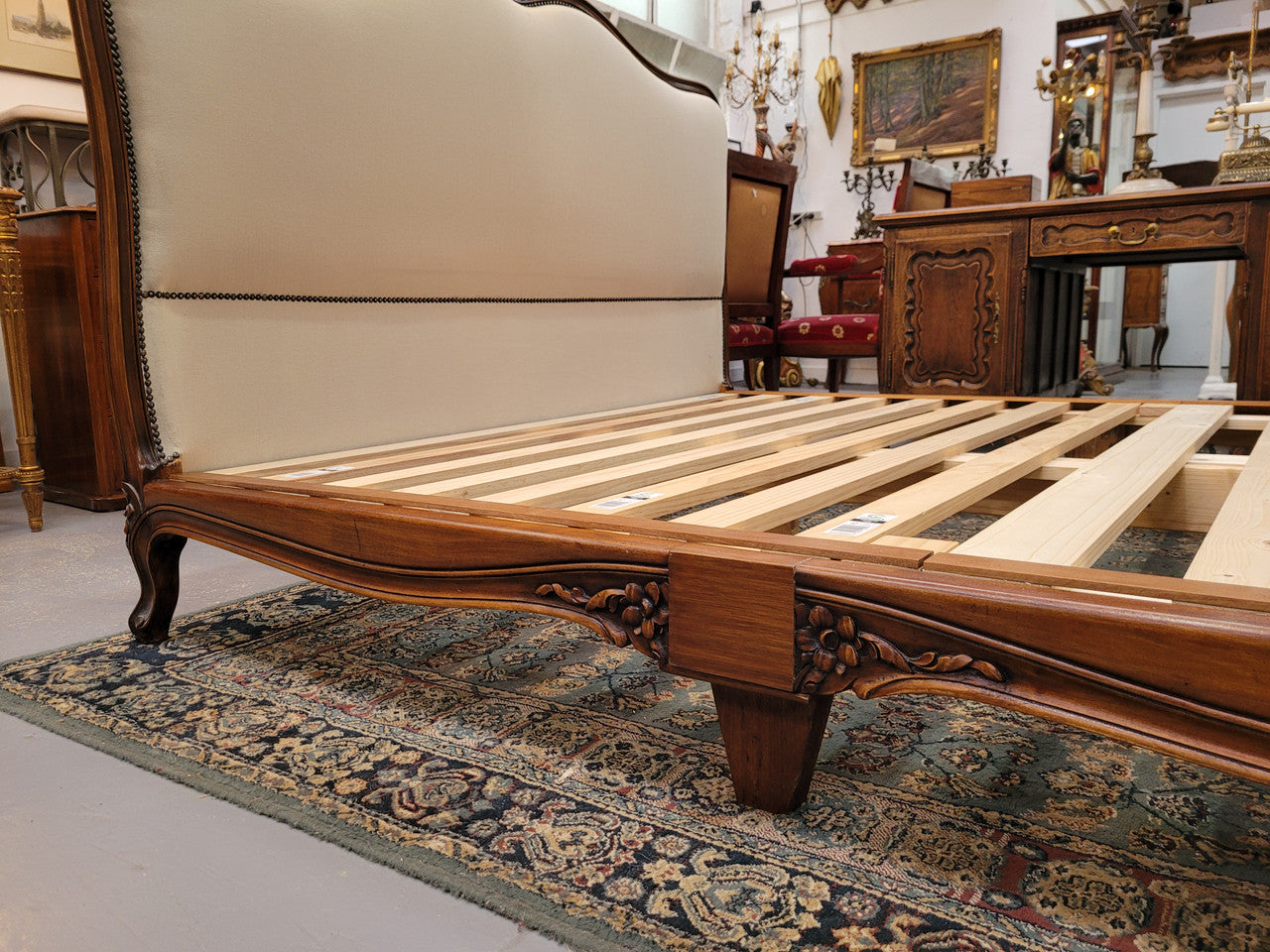 French Louis XV style queen size upholstered bed. Upholstery is in good condition and bed is complete with custom made slats. Just place your mattress on top.
