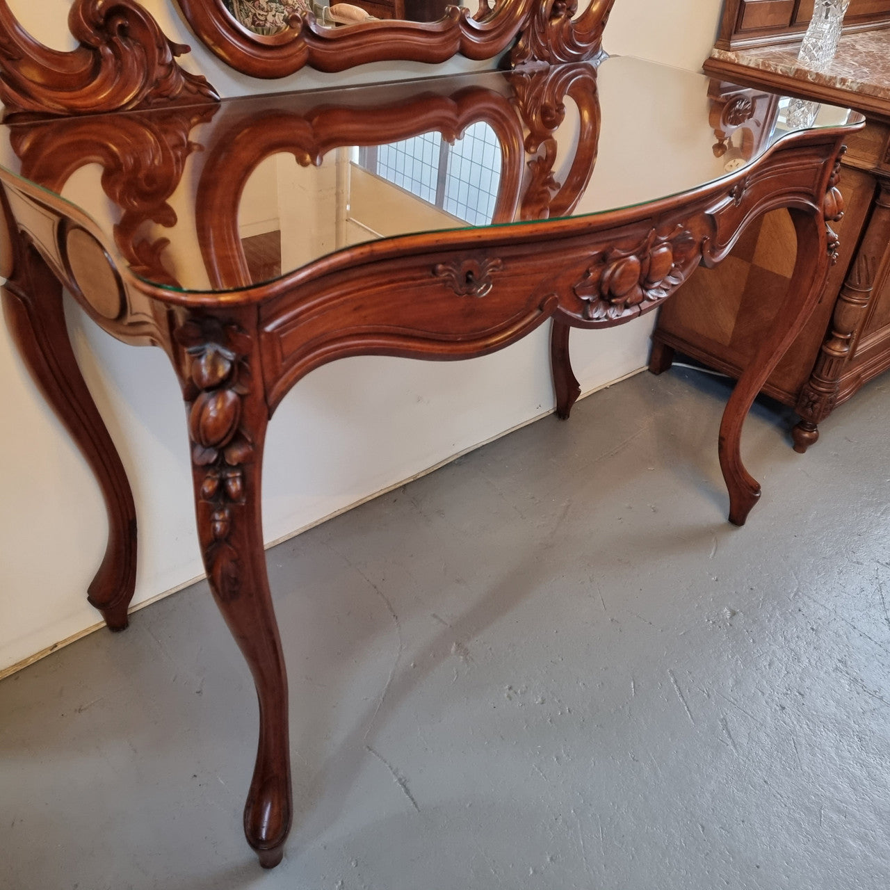 Walnut Parisian late 19th Century dressing table with mirror. Also has a glass top for protection, mirror moves and has drawers with key and working locks. In good original detailed condition.