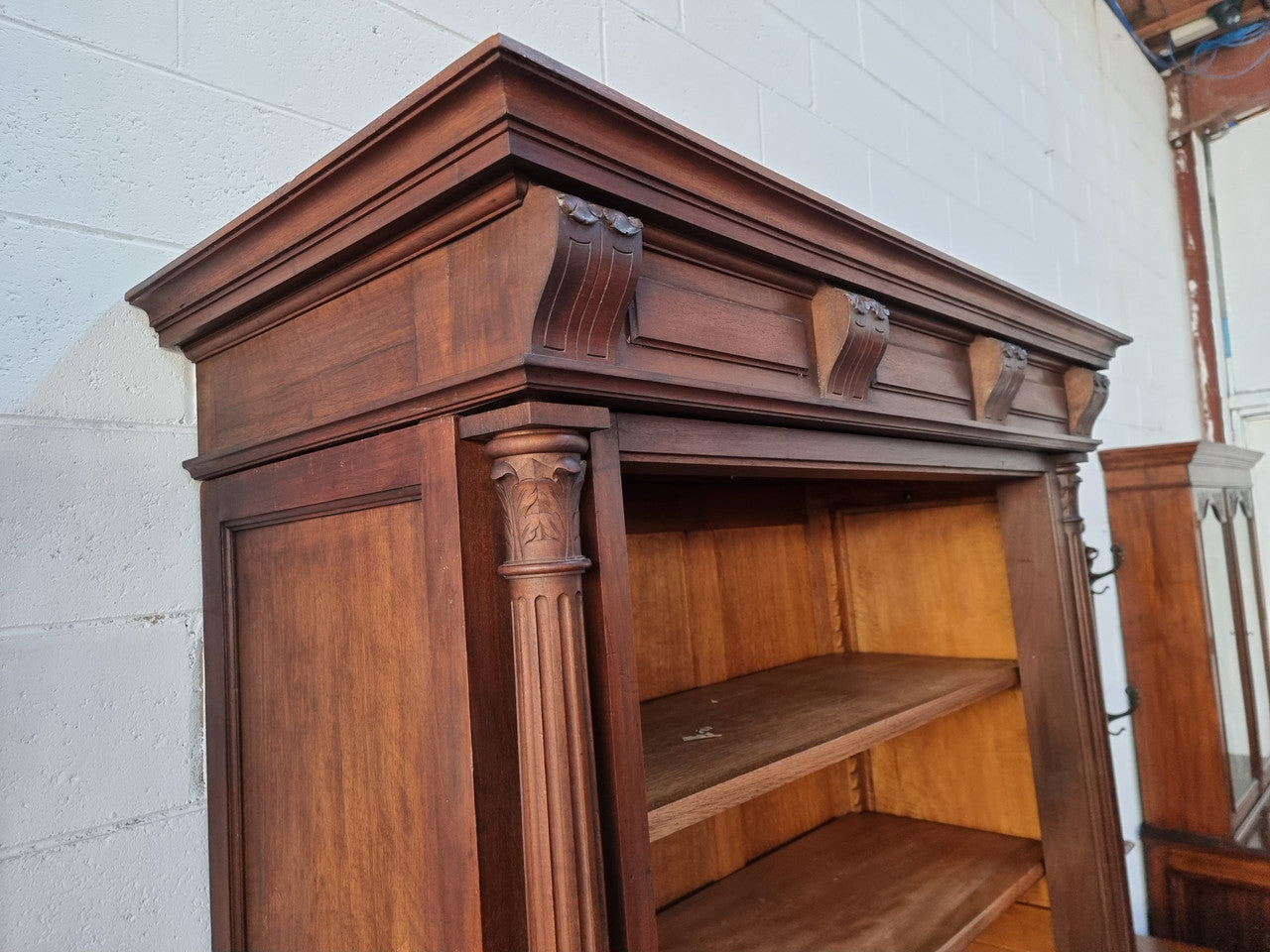 Henry II style 19th century walnut open bookcase with drawer which was originally an armoire now converted to a bookcase. It comes with four adjustable shelves. Is in good detailed condition.