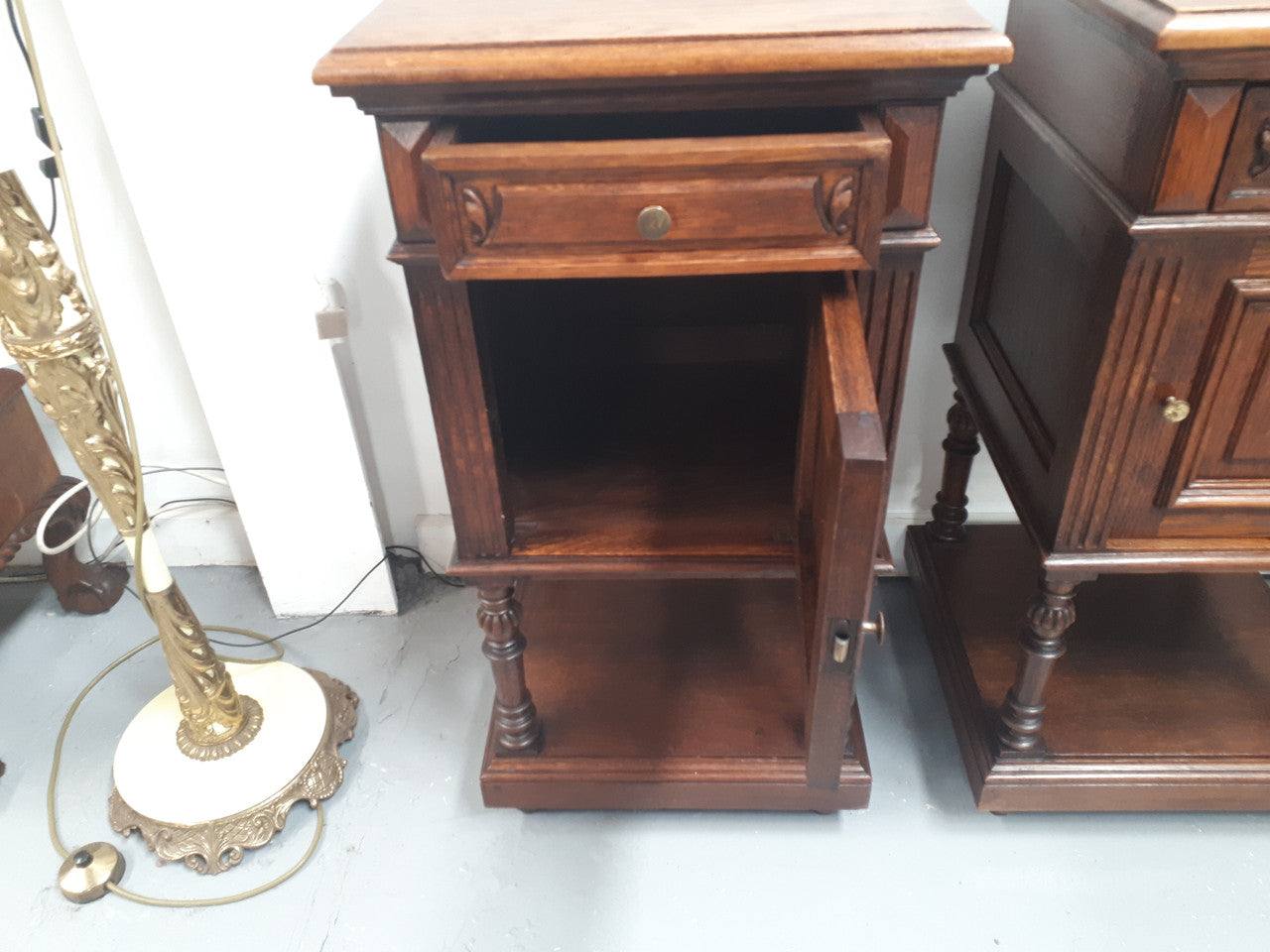 A hard to find pair of French Oak wooden top bedside cabinets. In good original condition. Circa 1920.