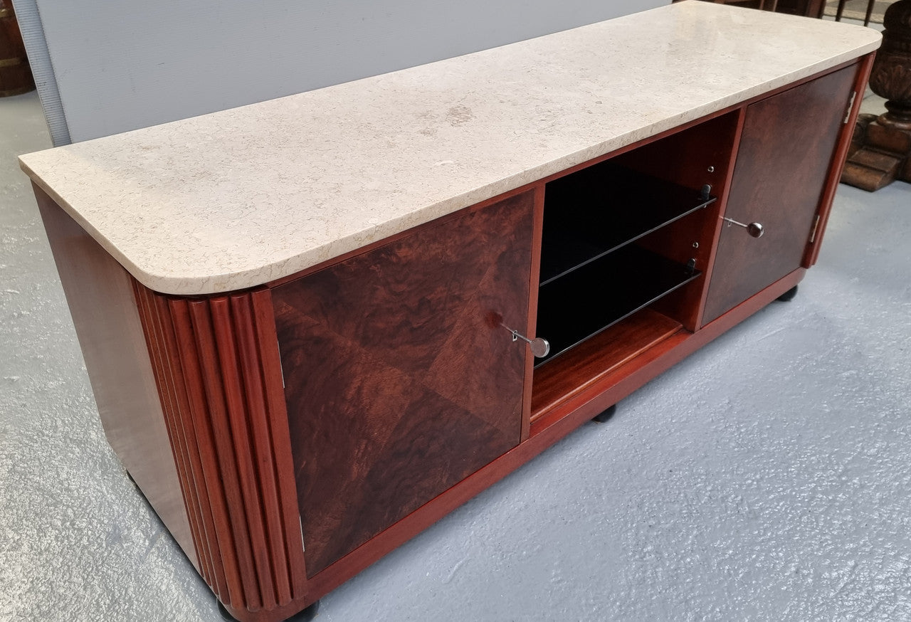Beautiful Bespoke Art Deco style walnut and mahogany low line cabinet with a marble top and plenty of storage. It has two doors with a shelf each side and in the middle in has two glass shelves. Would make an ideal TV cabinet and has a hole in the back to run cords through. In very good original detailed condition.